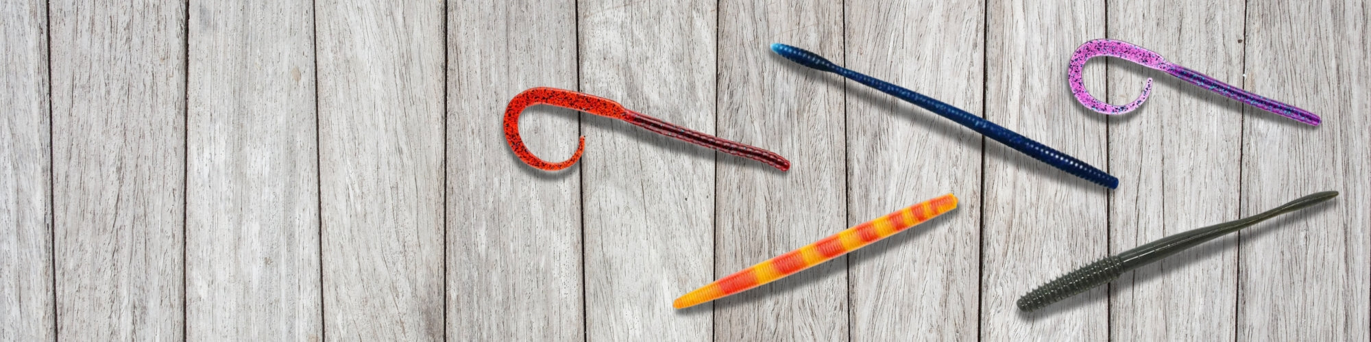 Soft plastic worms for bass fishing including ribbon-tail and straight-tail worm baits