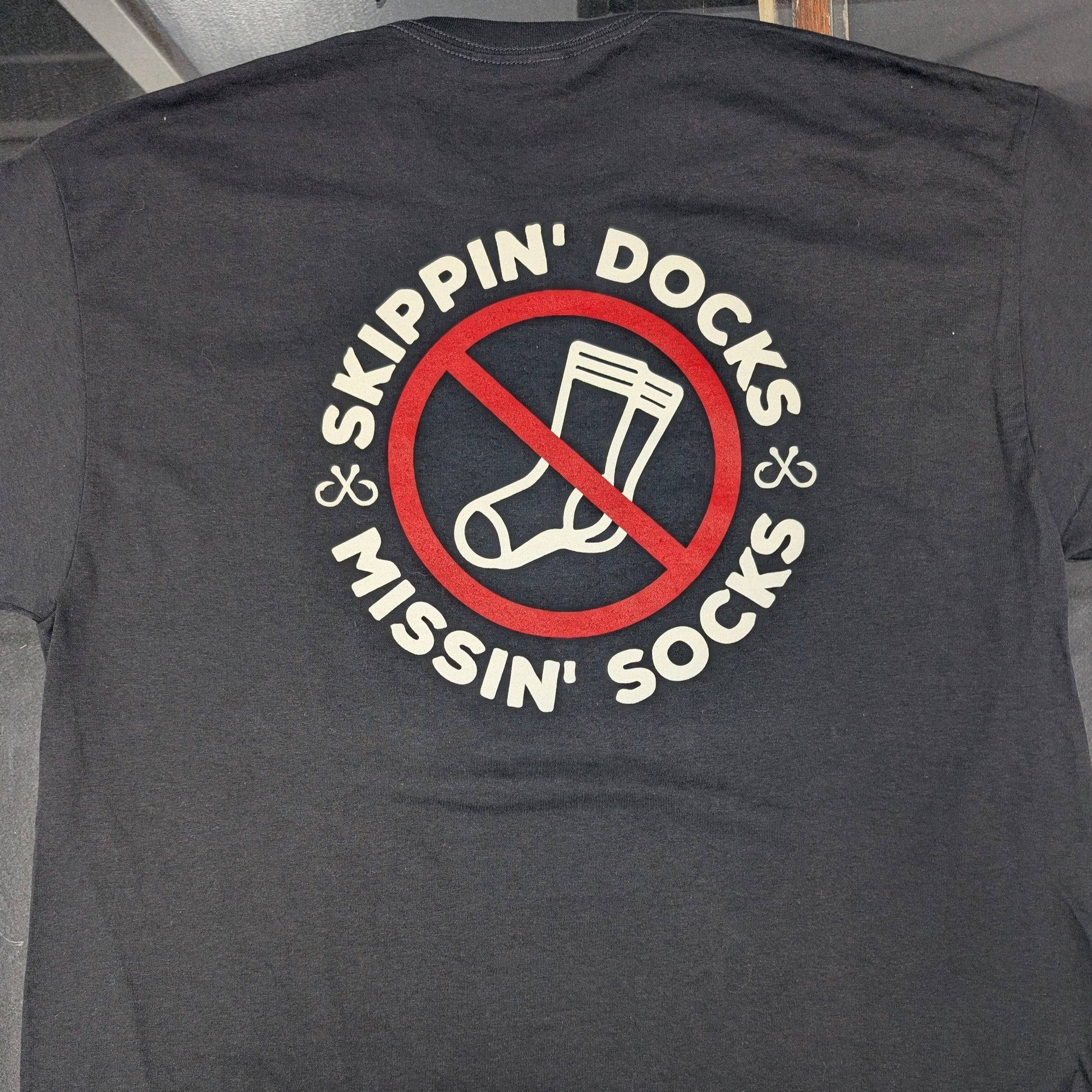 Hunter Baughman Skippin' Docks and Missin' Socks graphic T-shirt by Brazalo